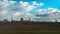 Slowly floating clouds over a large oil refinery. Timelapse of cloud movement. Environmental pollution