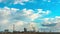 Slowly floating clouds over a large oil refinery. Timelapse of cloud movement. Environmental pollution