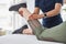 Slowly lift up your leg. an unrecognizable physiotherapist doing leg exercises with a patient inside her office at a