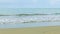Slowly panorama on blue endless sea with white waves running on sandy beach