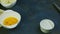 Slowly panorama on small white bowls with separated yolks, sliced butter, and salt