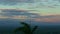 Slowly panorama on sunset skyscape with fluffy pink clouds above mountains