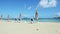 Slowly panorama at white sandy ocean shore with beach chairs and closed umbrellas