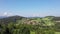 Slowly rising footage of aerial photography with drone in Bavarian forest near Grafenau with view of village Grueb, Germany