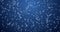 Slowly swirling white snowflakes on blue background, zooming.