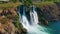 Slowmotion aerial video of the Lower Duden Waterfall in the city of Antalya