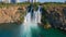 Slowmotion aerial video of the Lower Duden Waterfall in the city of Antalya. The drone slowly rotates around the
