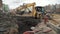 Slowmotion bulldozer excavator dump soil in to sewer trenche at building site