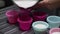 Slowmotion of filling muffin cups. Muffins pour out in silicone tray. Pouring dough cake into muffin baking dish.