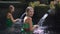 Slowmotion shot of two young women visiting the holly springs in Indonesia. Tirta Empul holy water springs on the Bali