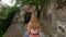 Slowmotion shot of a young family visiting the Gunung Kawi Sebatu Temple. 11th century temple and burial complex in