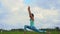 Slowmotion shot of a young woman practicing yoga on a beautiful rice field