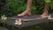 Slowmotion shot of a young woman that using a Sadhu board or a nail board in a tropical surrounding