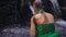Slowmotion shot of a young woman visiting the holly springs in Indonesia. Tirta Empul holy water springs on the Bali