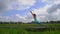 Slowmotion steadicam shot of a young woman practicing yoga on a beautiful rice field