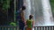 Slowmotion video. A father and son are portrayed as tourists visiting the breathtaking Upper Duden waterfall in the