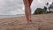 Slowmotion view to bare foot walking on the beach at summer vacation holidays