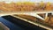 Sluice Gates on the River. Aerial view barge, ship in the river gateway in autumn sunny day.