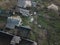 Slum rural houses in village of Eastern Europe past USSR region with dirt and gray colors, aerial foreshortening mobile