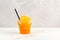 Slushie drink in disposable plastic cup. Orange Granizado. Refreshing summer iced drink. Sweet Shaved ice with natural orange