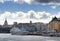 Slussen and the old town from the seaside with boats and clouds