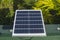 A small 50 watt Polycrystalline solar panel mounted on the edge of the roof of a house for an off-grid light