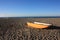 Small abandoned fishing yellow boat