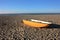 Small abandoned fishing yellow boat