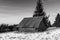 Small abandoned wood house at wintertime on the top of the mountain in the Carpathian mountains