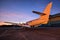 Small aeroplane infront of aircraft hangar