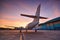 Small aeroplane infront of aircraft hangar