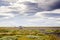 Small airfield in Iceland with small cessna plane with sheep on grasslands with nice sky