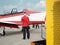 Small Airplane Refueling in Airport. Airplane Technician Standby During Fuel Filling Intake