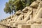 Small alley of sheep-headed sphinxes in front of the Karnak Temple. Close-up. Karnak Temple is famous Egyptian landmark