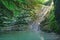 Small amazing lake and a creek flowing into it among southern jungle forests