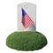 Small American flag and headstone on green grass islet isolated on white