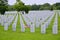 A small American flag honors the gravesite of a World War II veterans.