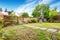 Small American house exterior with Green front yard.