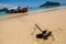 Small Anchor in Beach Sand for Parking Tourism Boat in the Island