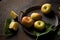 Small apples on a metal tray on a dark background