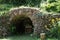 A small artificial cave built out flat stones layered carefully over each other.