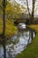 Small autumn river with a bridge