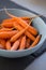 Small baby carrots in soup plates