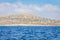 Small backwater surrounded by a stone cliff with azure water in Cyprus