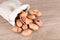 A small bag of pecans scattered on the table