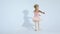 A small ballerina dances with enthusiasm. The girl is engaged in ballet