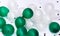 Small  balloons green and white color on floor background