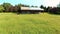 A small barn in a green meadow