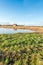 Small barn reflected in the water surface