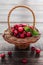 Small basket of cranberries on a wooden table